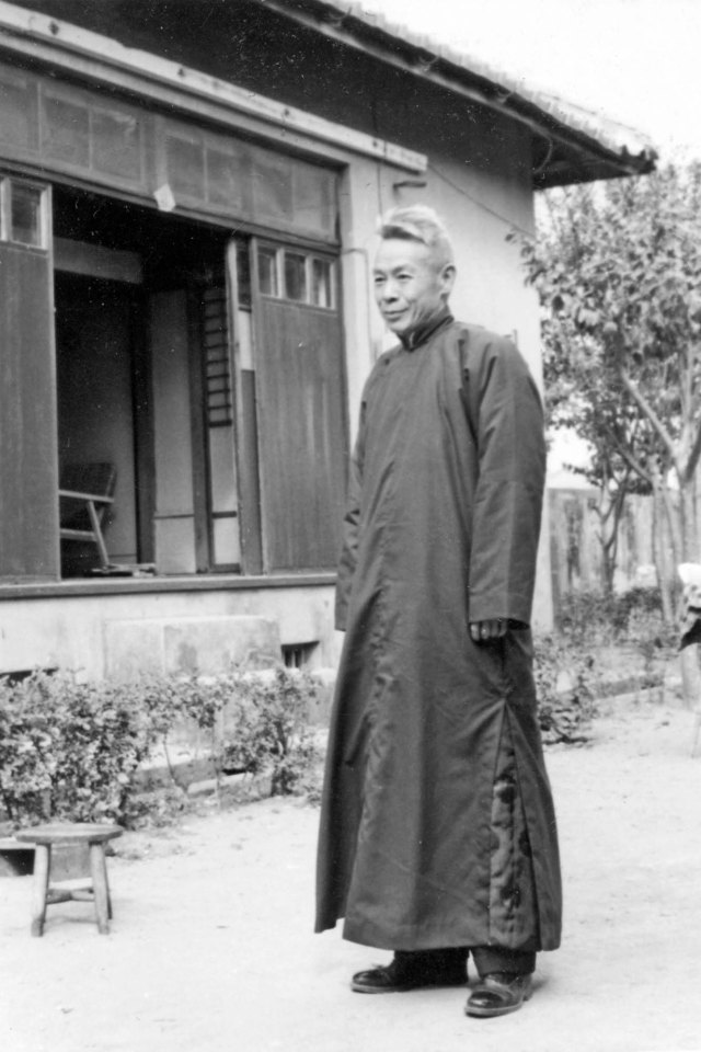 Dad in front of our house